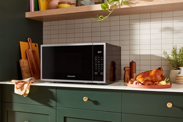 Open convection microwave showing interior