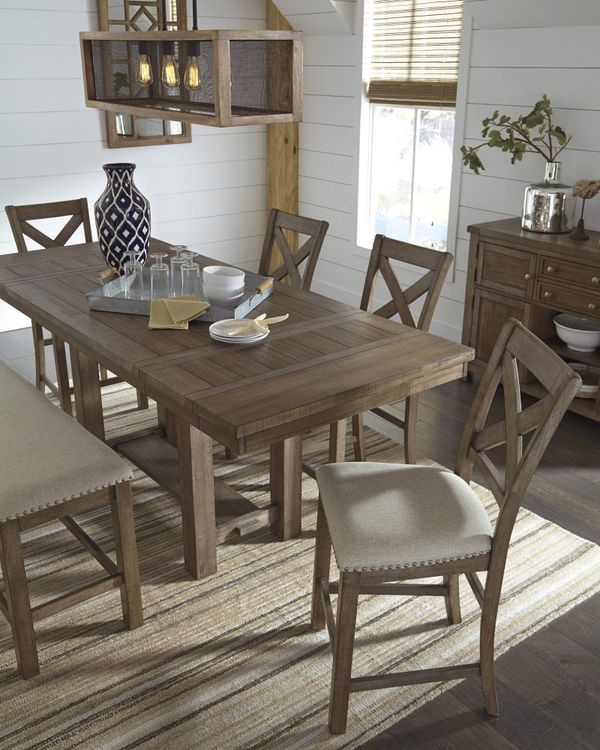 A dining room with a chandelier over the table A dining room with a chandelier over the table