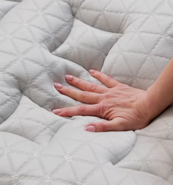 A close-up view of the intricate stitching and premium fabric on a Helix mattress cover. A close-up view of the intricate stitching and premium fabric on a Helix mattress cover.