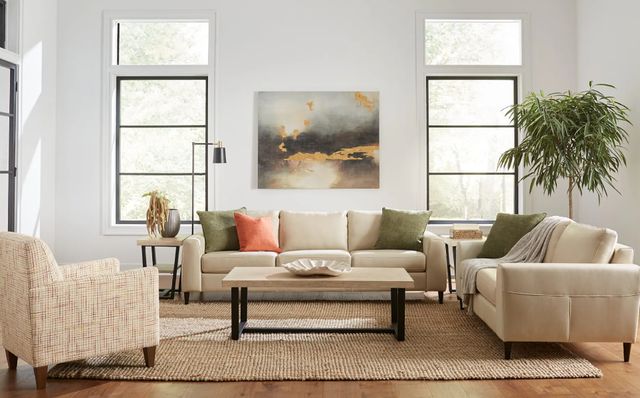 Credit: Signature Design by Ashley Front view of a modern living room with a mid-century modern sofa set
