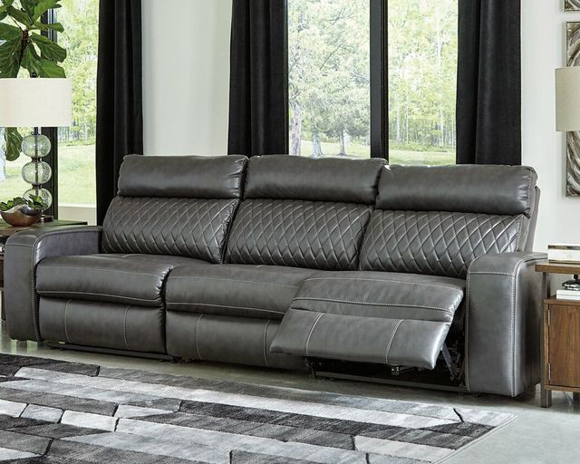 front view of a black faux leather sofa in a modern living room 