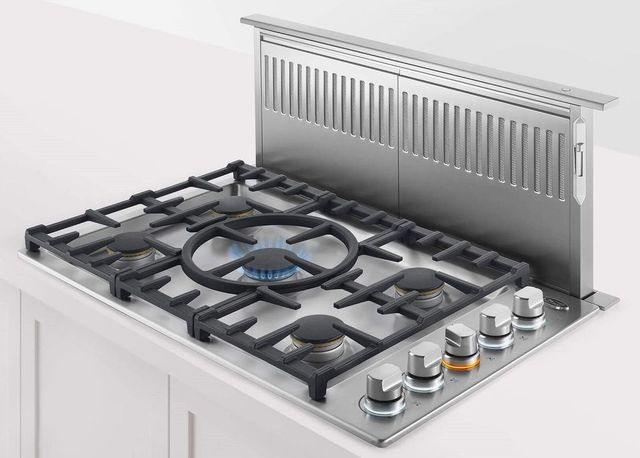 Downdraft vs Overhead Comparison Comparison view of a downdraft and overhead range hood