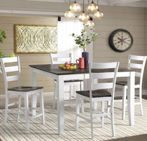 A casual dining space with a counter height dining table and stools A casual dining space with a counter height dining table and stools